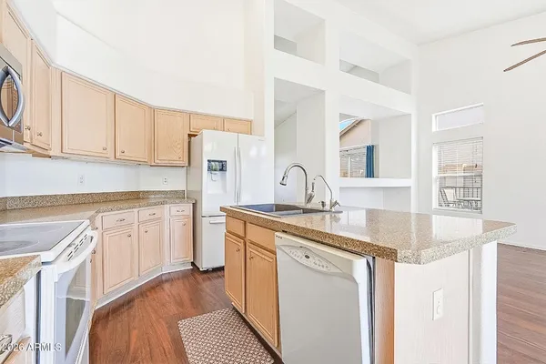 a kitchen with a sink and a large window
