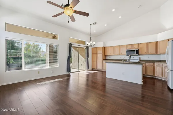 a view of an empty room with a ceiling fan