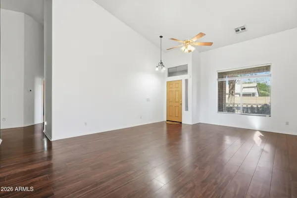 a kitchen with a refrigerator sink and cabinets