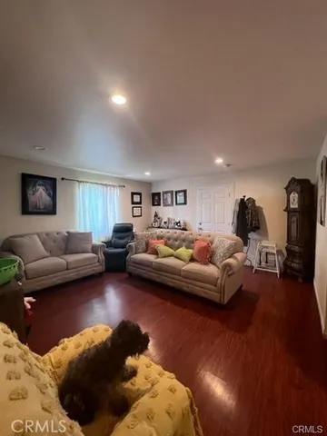 a living room with furniture and a lamp