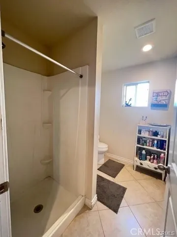 a bathroom with a shower and a sink