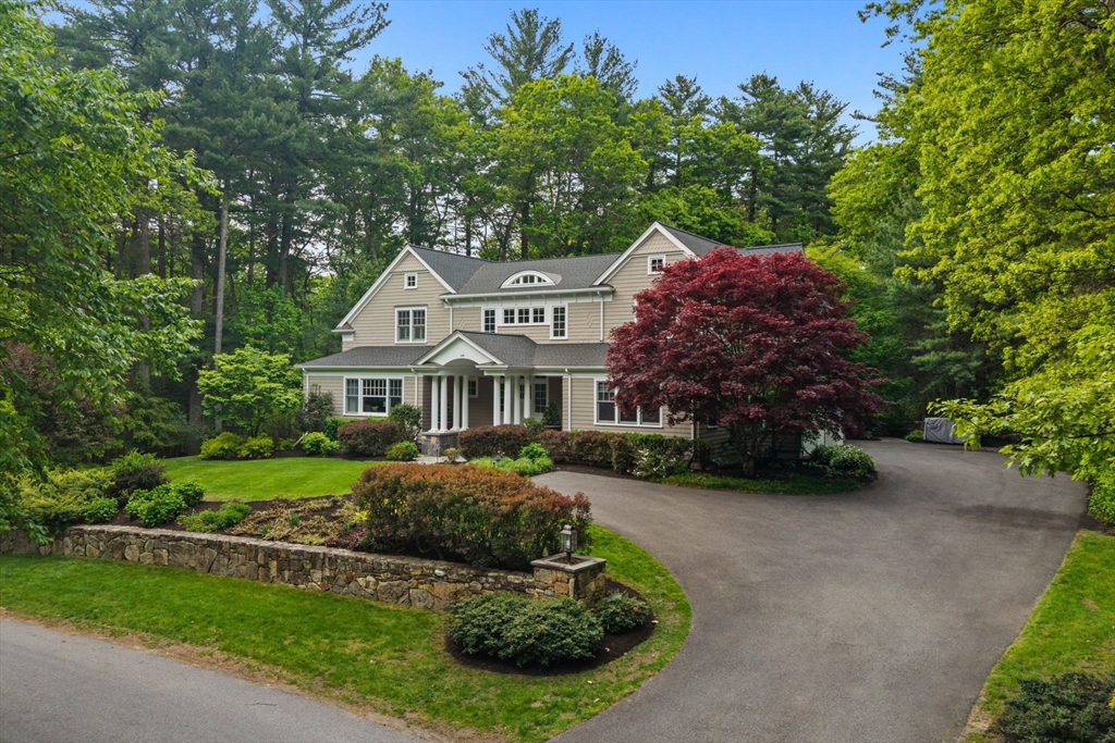 244 Musterfield Road Concord, MA 01742 - Photo 2 of 42 a front view of a house with a garden