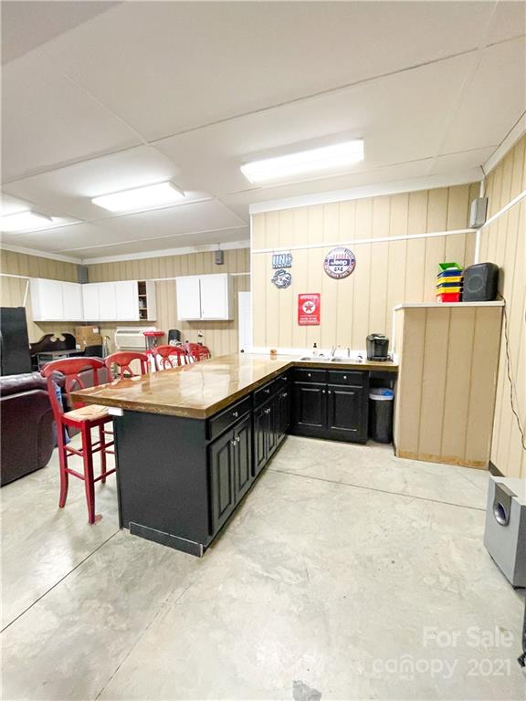 6974 Lackey Road Vale, NC 28168 - Photo 34 of 40 a kitchen with stainless steel appliances a sink and a refrigerator