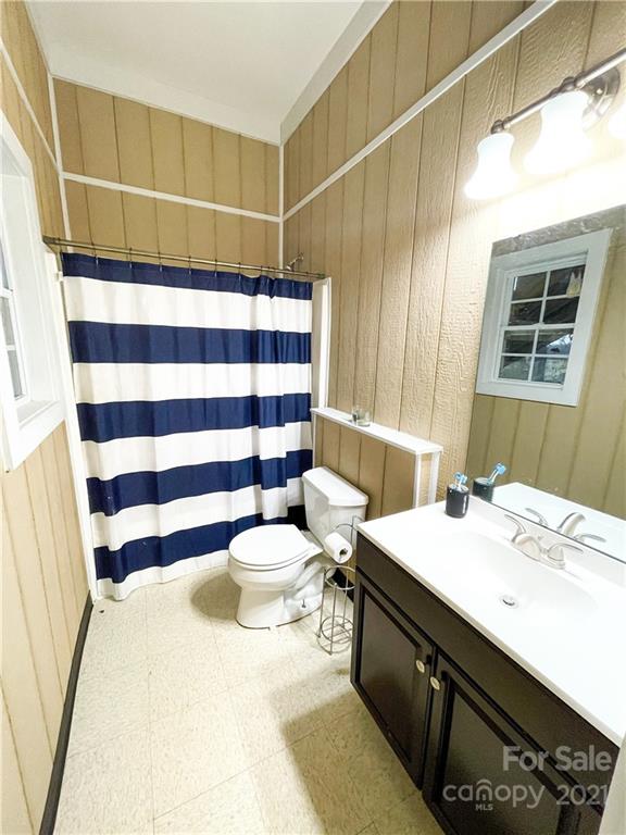 6974 Lackey Road Vale, NC 28168 - Photo 36 of 40 a bathroom with a sink a toilet a shower and a mirror