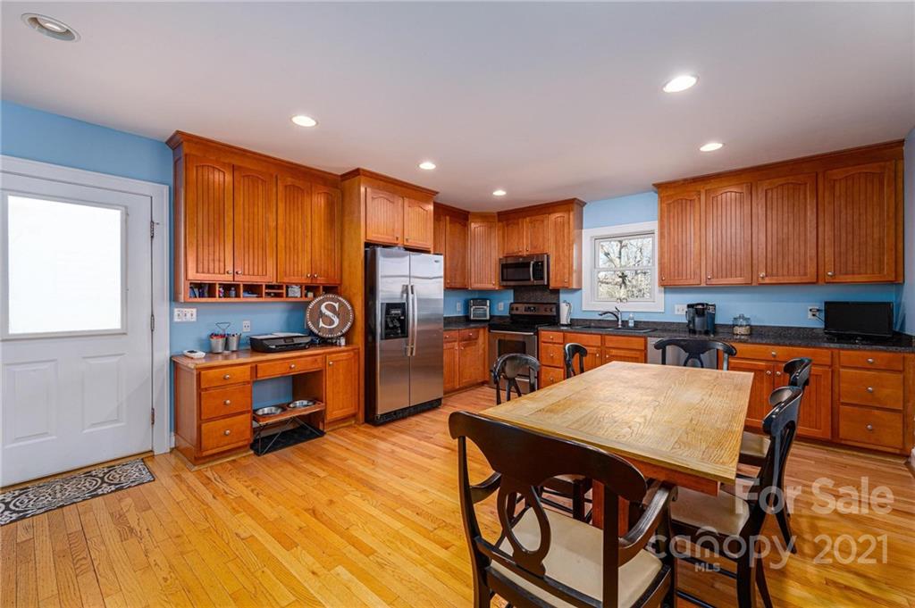 6974 Lackey Road Vale, NC 28168 - Photo 5 of 40 a kitchen with stainless steel appliances granite countertop a refrigerator a sink a stove and island