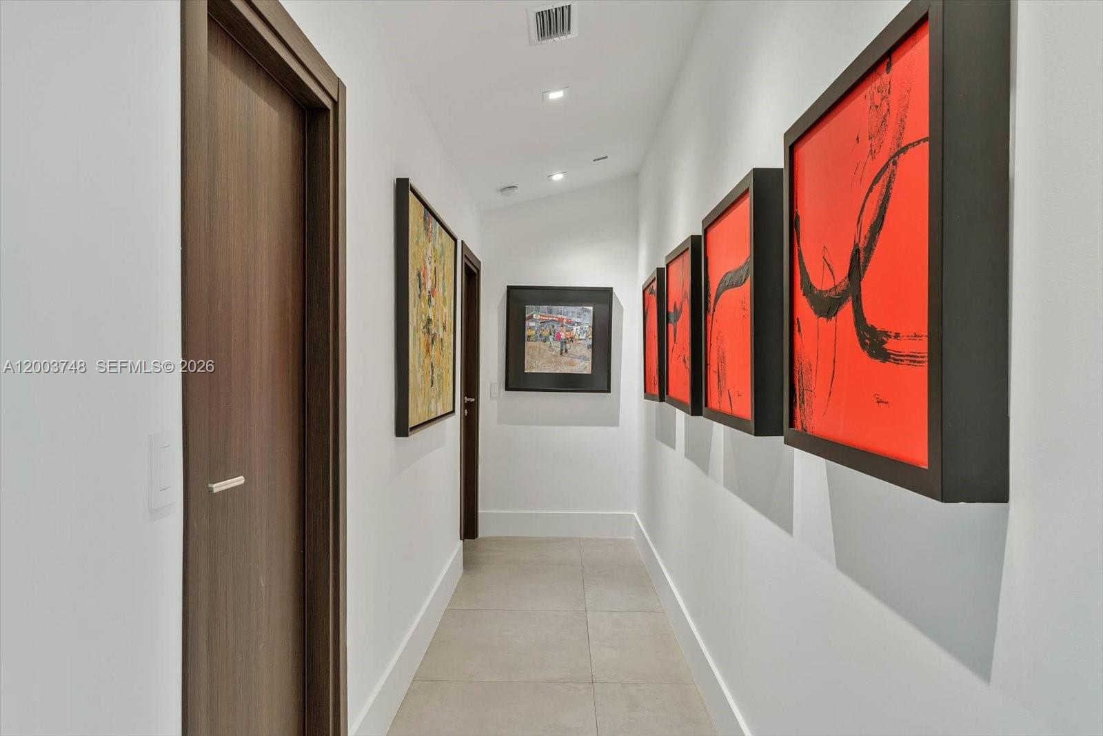 2675 Hackney Road Weston, FL 33331 - Photo 51 of 61 a hallway with wooden floor and windows