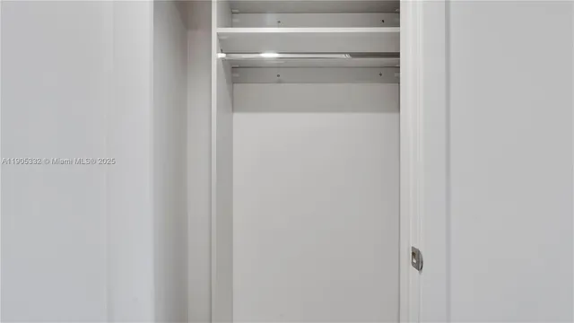 a bathroom with a shower and a sink