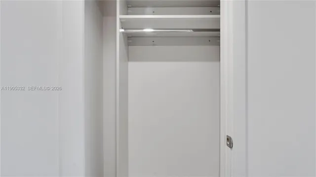 a bathroom with a shower and a sink