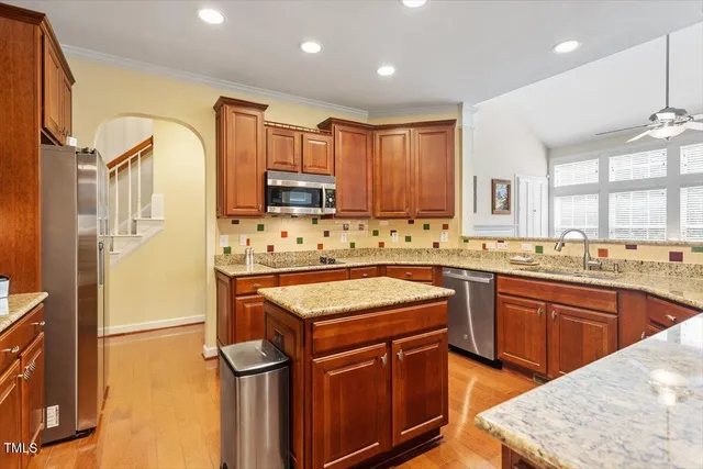 a bathroom with a shower sink and mirror