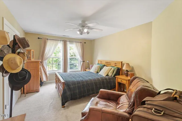 a bedroom with furniture and a window