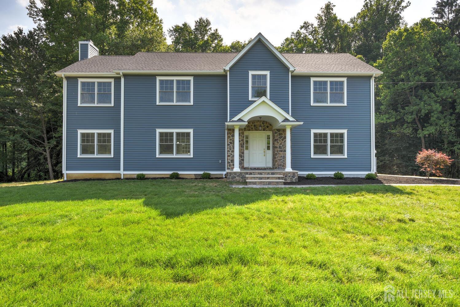 923 Iron Bridge Road Asbury, NJ 08802 - Photo 1 of 41 a front view of a house with a yard
