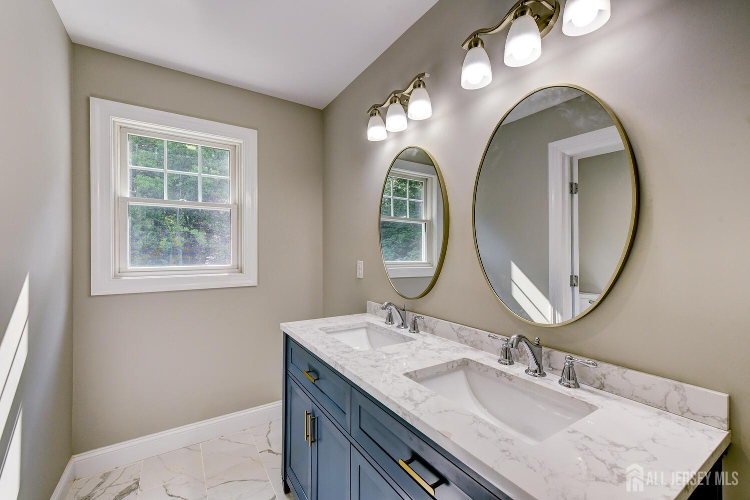923 Iron Bridge Road Asbury, NJ 08802 - Photo 11 of 41 a bathroom with a granite countertop double vanity sink and a mirror