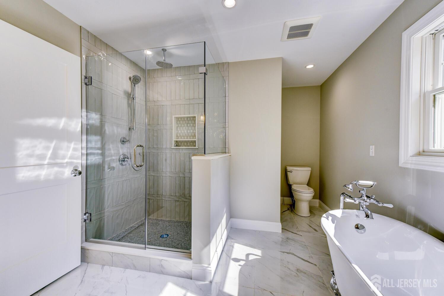 923 Iron Bridge Road Asbury, NJ 08802 - Photo 13 of 41 a bathroom with a tub shower and sink