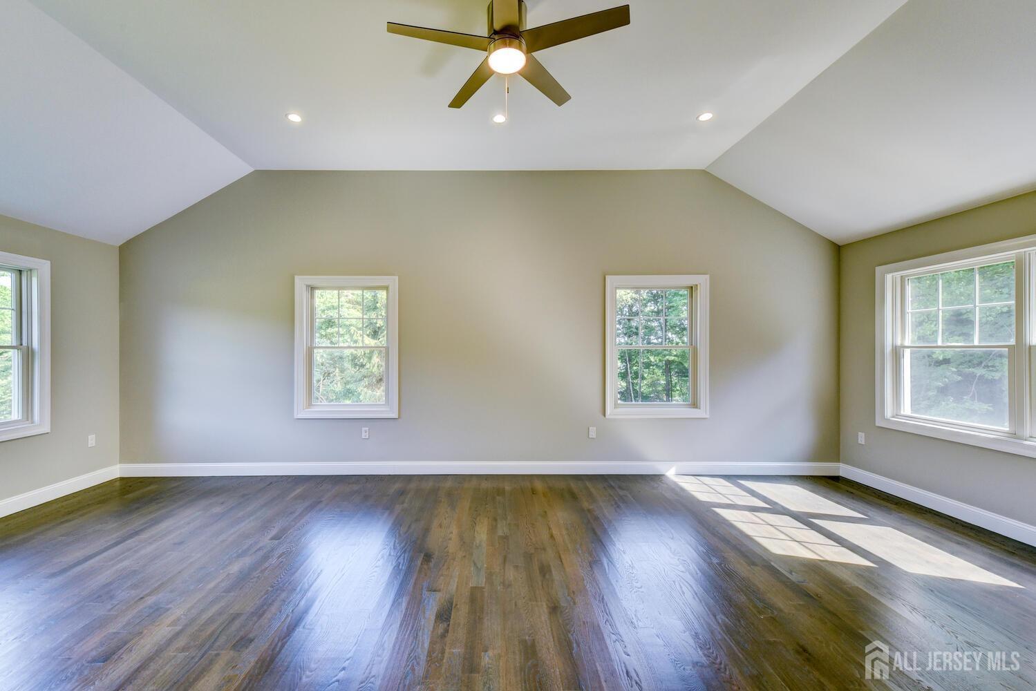 923 Iron Bridge Road Asbury, NJ 08802 - Photo 18 of 41 a view of an empty room with wooden floor and a window