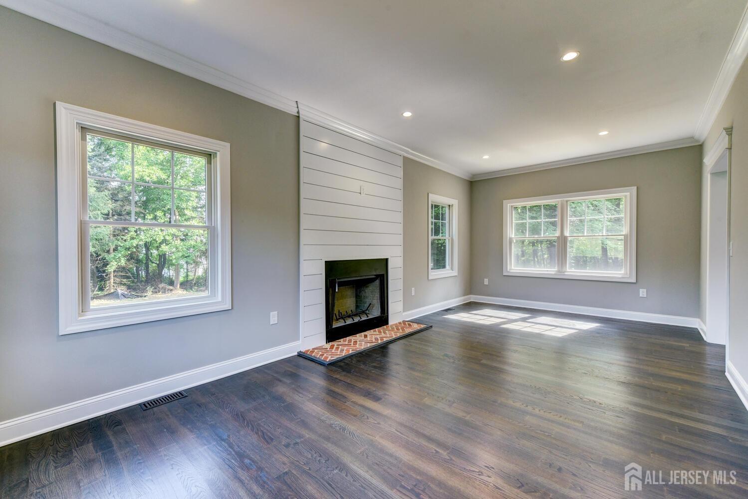 923 Iron Bridge Road Asbury, NJ 08802 - Photo 20 of 41 a view of an empty room with wooden floor and a window