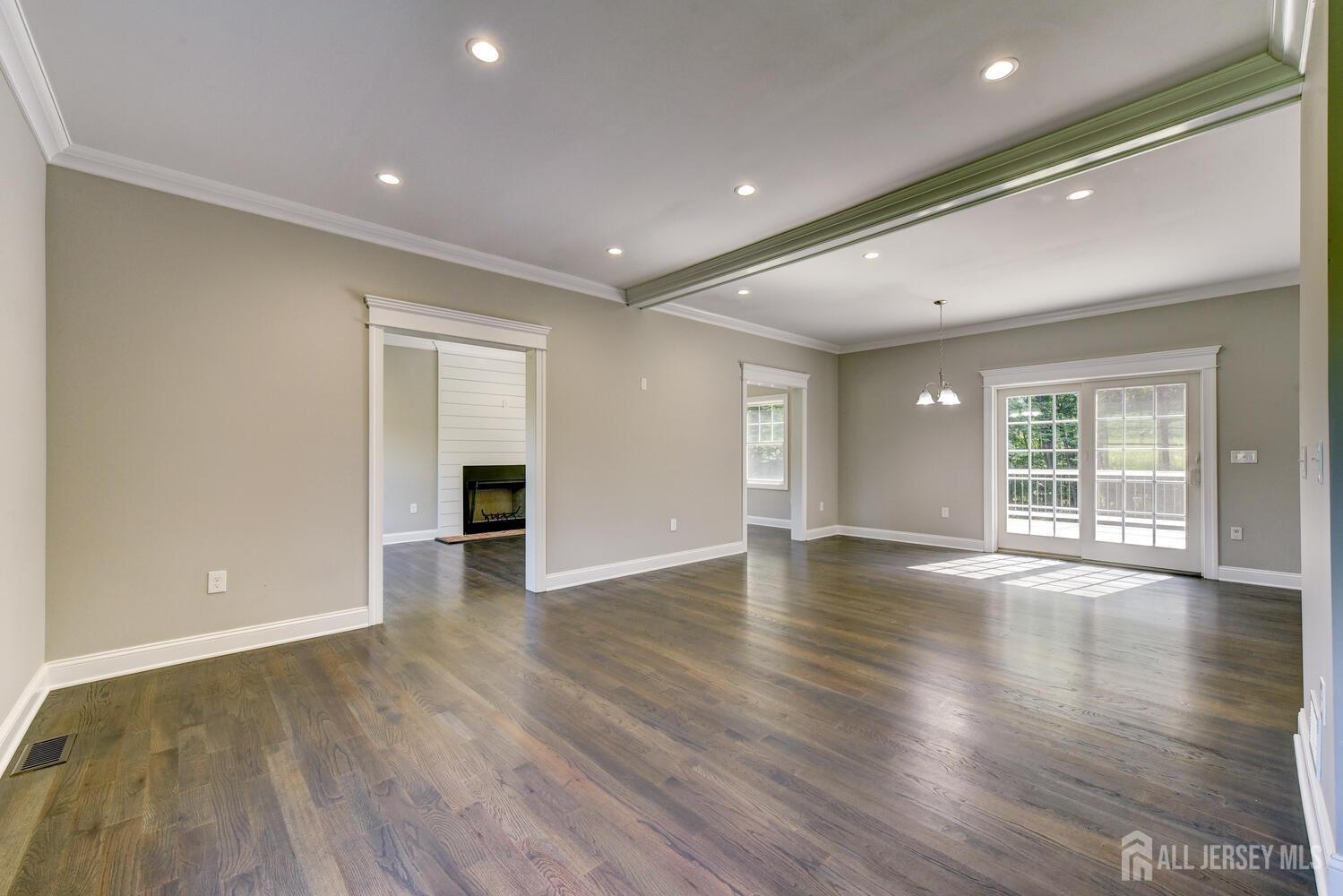 923 Iron Bridge Road Asbury, NJ 08802 - Photo 2 of 41 a view of an empty room with wooden floor and a window