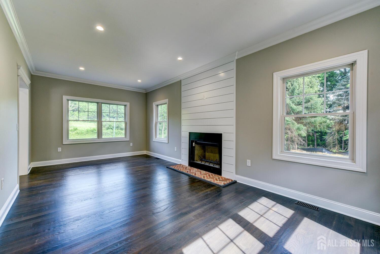 923 Iron Bridge Road Asbury, NJ 08802 - Photo 21 of 41 a view of an empty room with wooden floor and a window