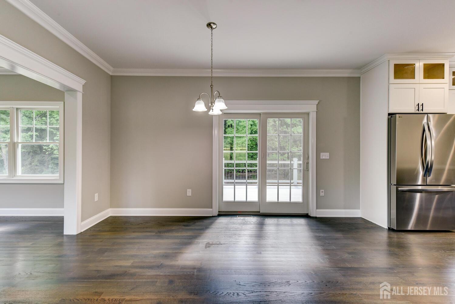 923 Iron Bridge Road Asbury, NJ 08802 - Photo 28 of 41 a view of an empty room with window and wooden floor