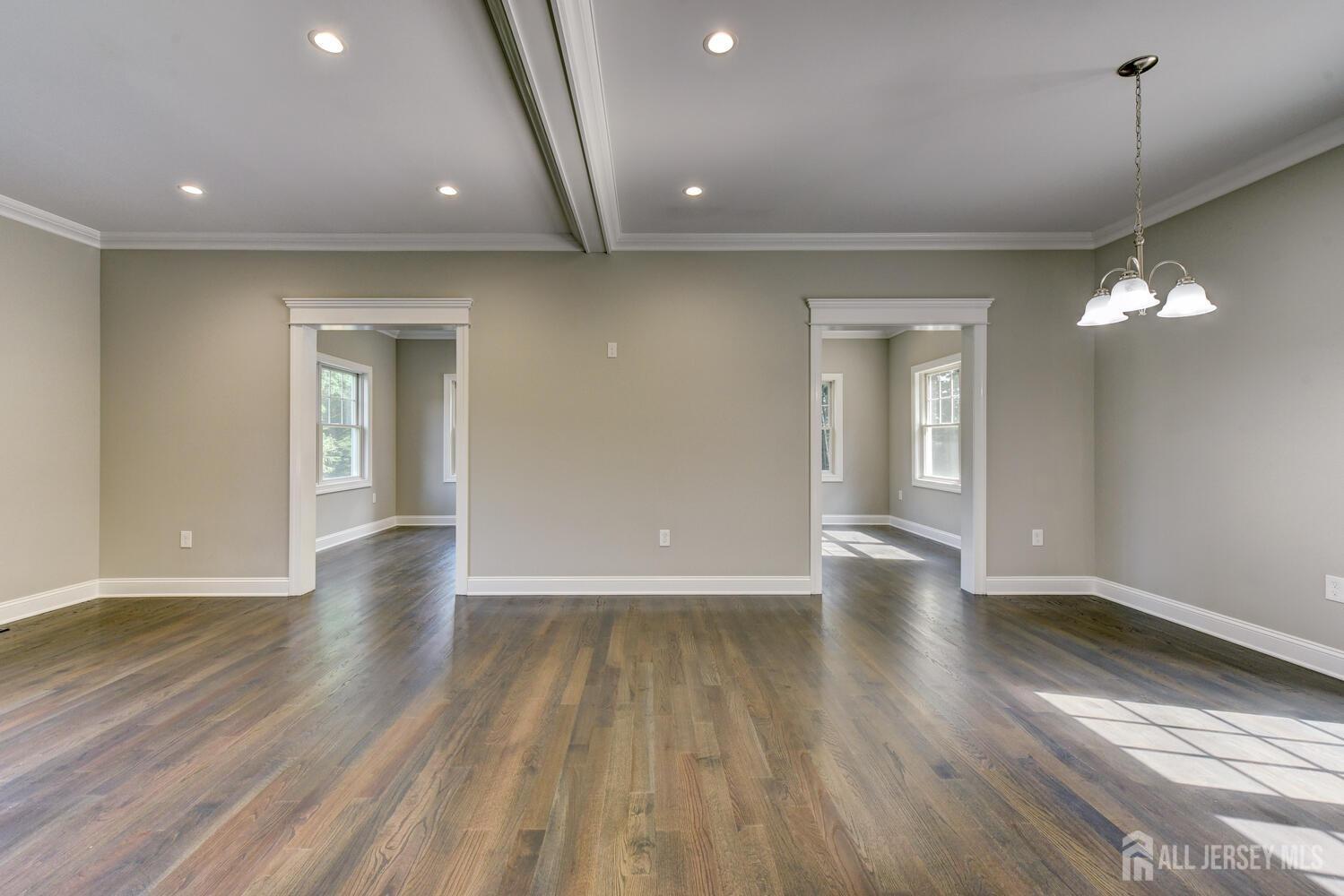 923 Iron Bridge Road Asbury, NJ 08802 - Photo 29 of 41 a view of an empty room with wooden floor and a window