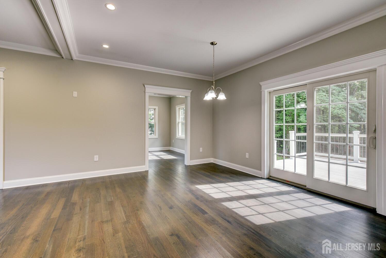923 Iron Bridge Road Asbury, NJ 08802 - Photo 30 of 41 an empty room with wooden floor and windows