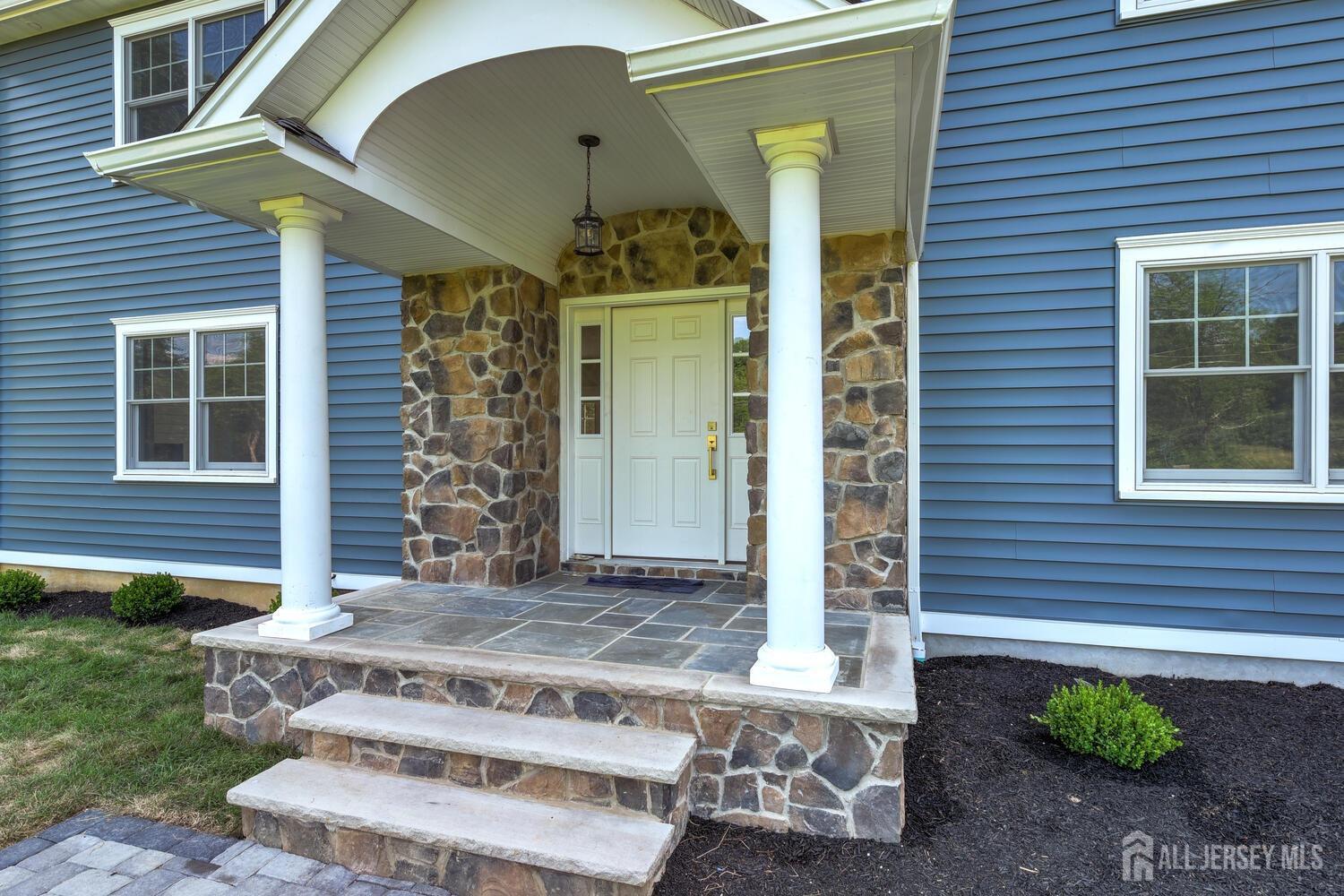 923 Iron Bridge Road Asbury, NJ 08802 - Photo 31 of 41 a front view of a house with a garden
