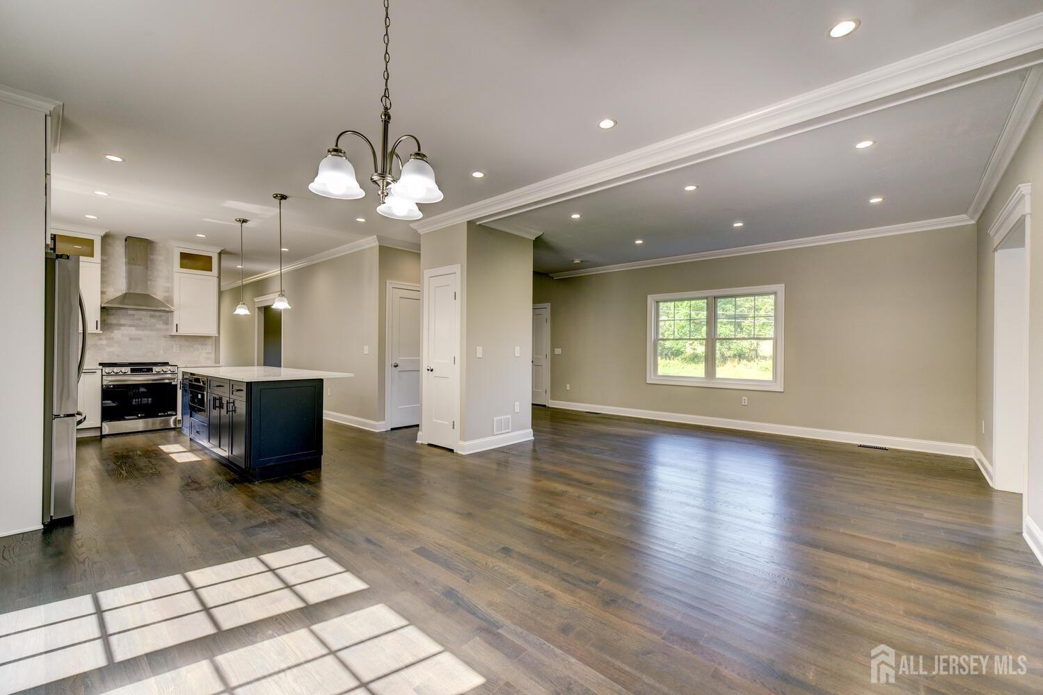 923 Iron Bridge Road Asbury, NJ 08802 - Photo 32 of 41 a view of a living room kitchen with a table and chairs