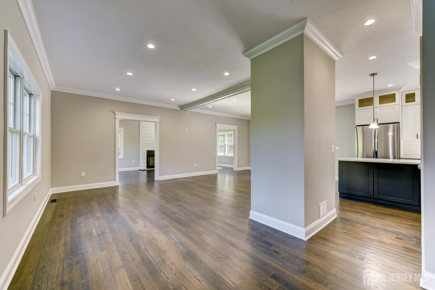 923 Iron Bridge Road Asbury, NJ 08802 - Photo 35 of 41 a view of an empty room with wooden floor and a window