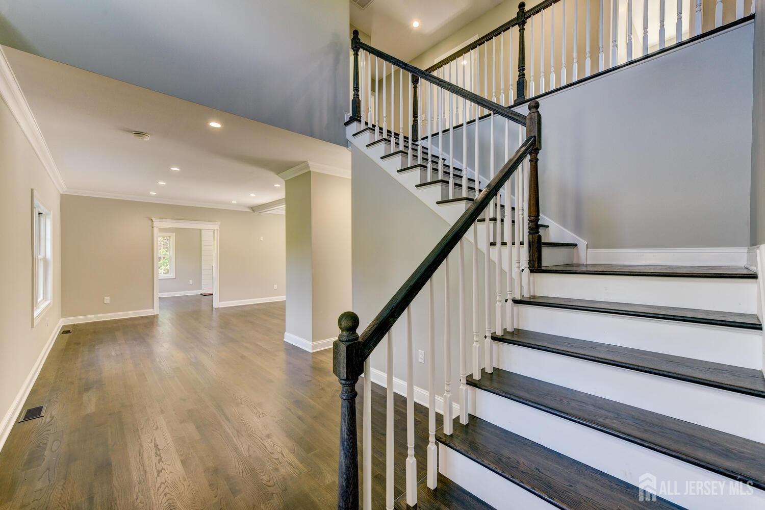 923 Iron Bridge Road Asbury, NJ 08802 - Photo 36 of 41 a view of staircase with wooden floor and white walls