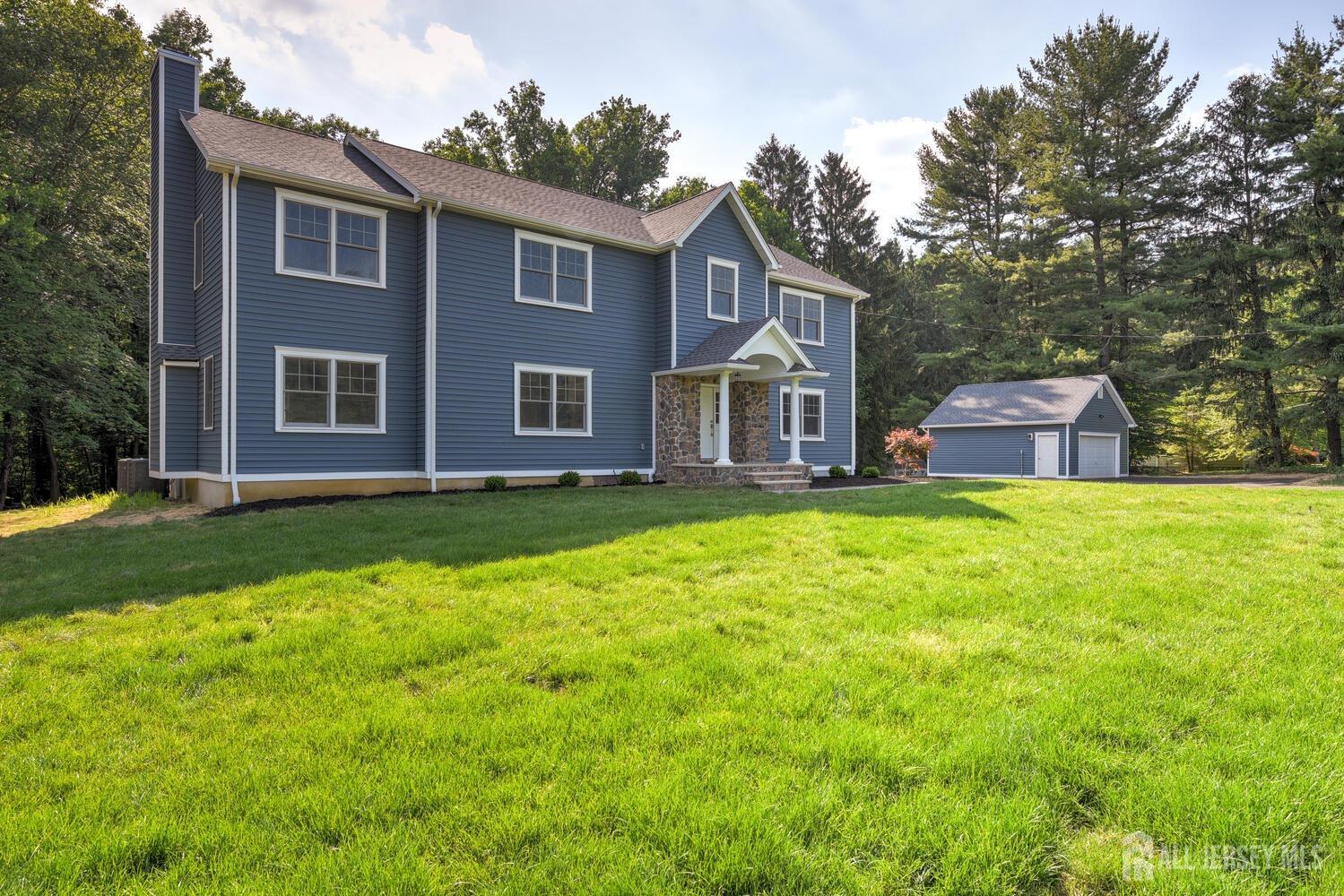 923 Iron Bridge Road Asbury, NJ 08802 - Photo 40 of 41 a front view of house with yard and green space