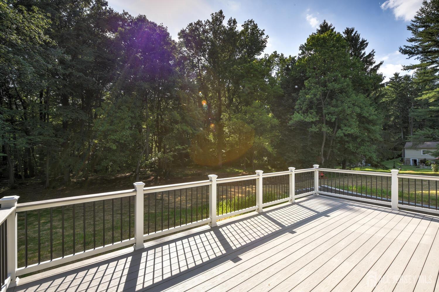 923 Iron Bridge Road Asbury, NJ 08802 - Photo 4 of 41 a view of a balcony with wooden floor and fence