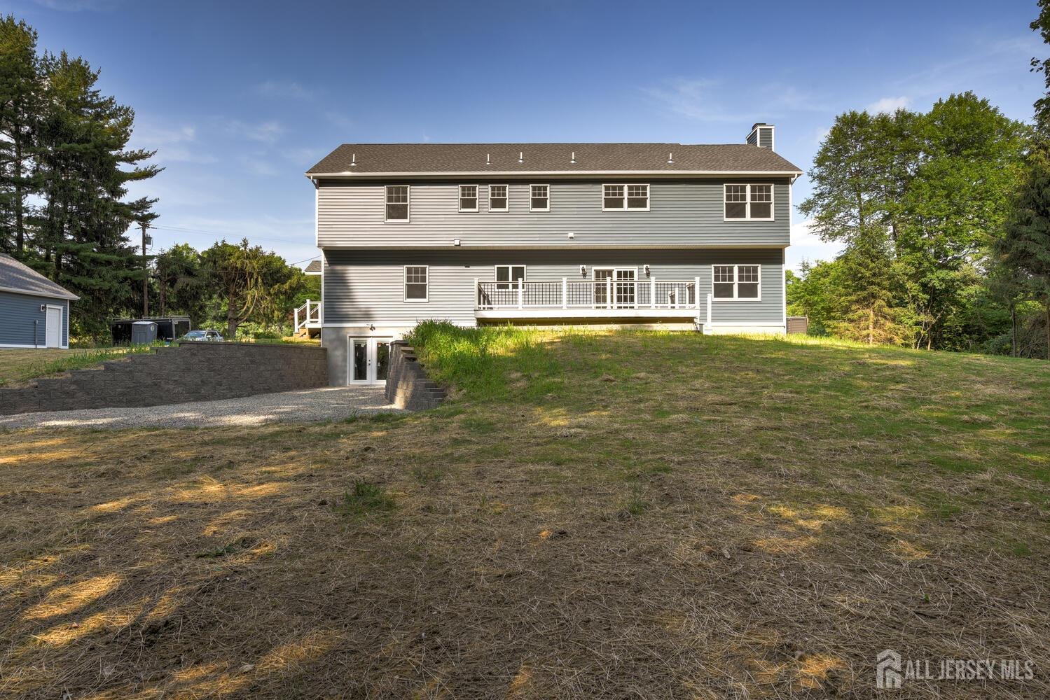 923 Iron Bridge Road Asbury, NJ 08802 - Photo 6 of 41 a view of a building with a yard