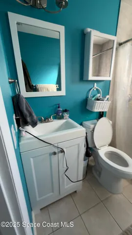 a bathroom with a toilet and a sink