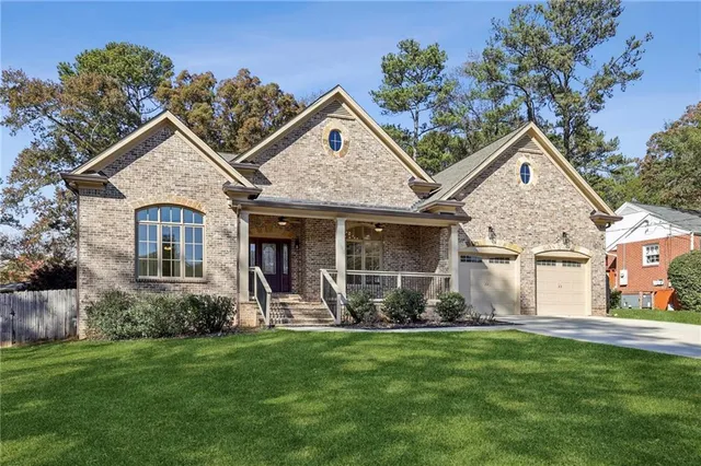 a view of a house with patio and garden