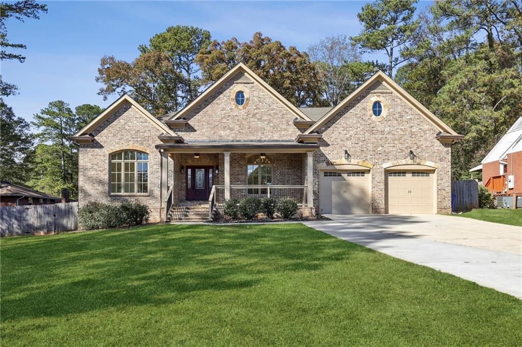 3170 Lavista Road Decatur, GA 30033 - Photo 2 of 29 a front view of a house with a yard and porch