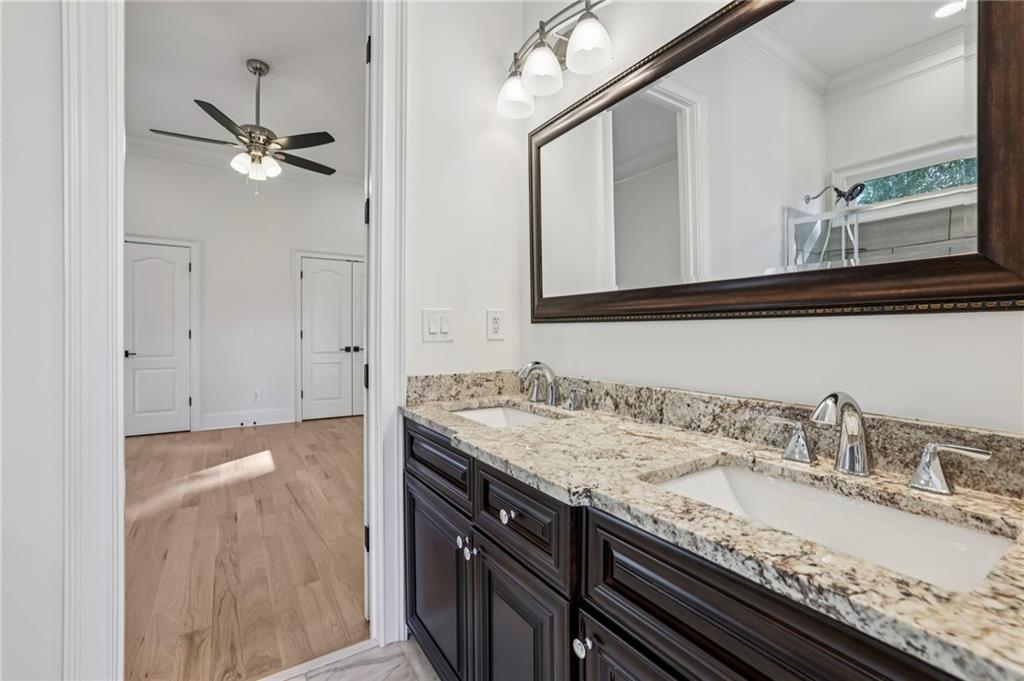 3170 Lavista Road Decatur, GA 30033 - Photo 21 of 29 a bathroom with a granite countertop sink and a mirror