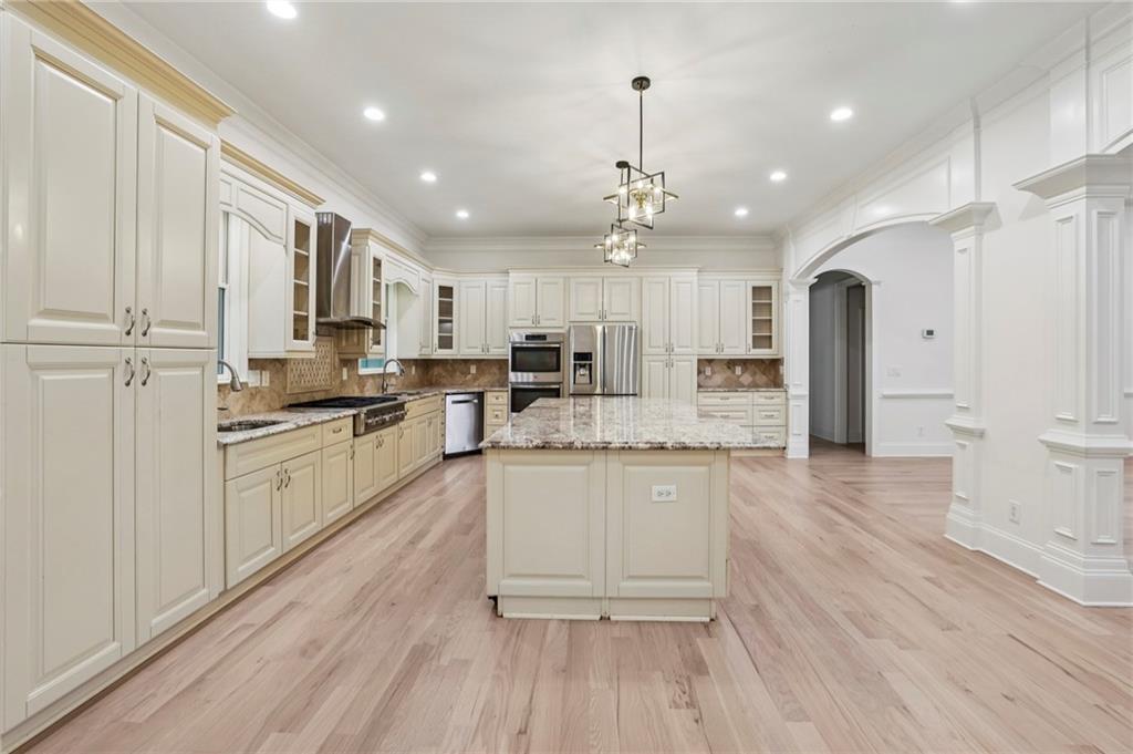 3170 Lavista Road Decatur, GA 30033 - Photo 23 of 29 a large kitchen with granite countertop a large counter top a sink stainless steel appliances and cabinets