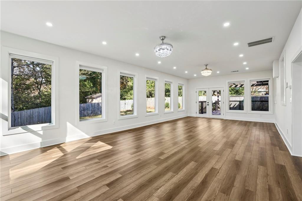 3170 Lavista Road Decatur, GA 30033 - Photo 24 of 29 a view of an empty room with wooden floor and a window
