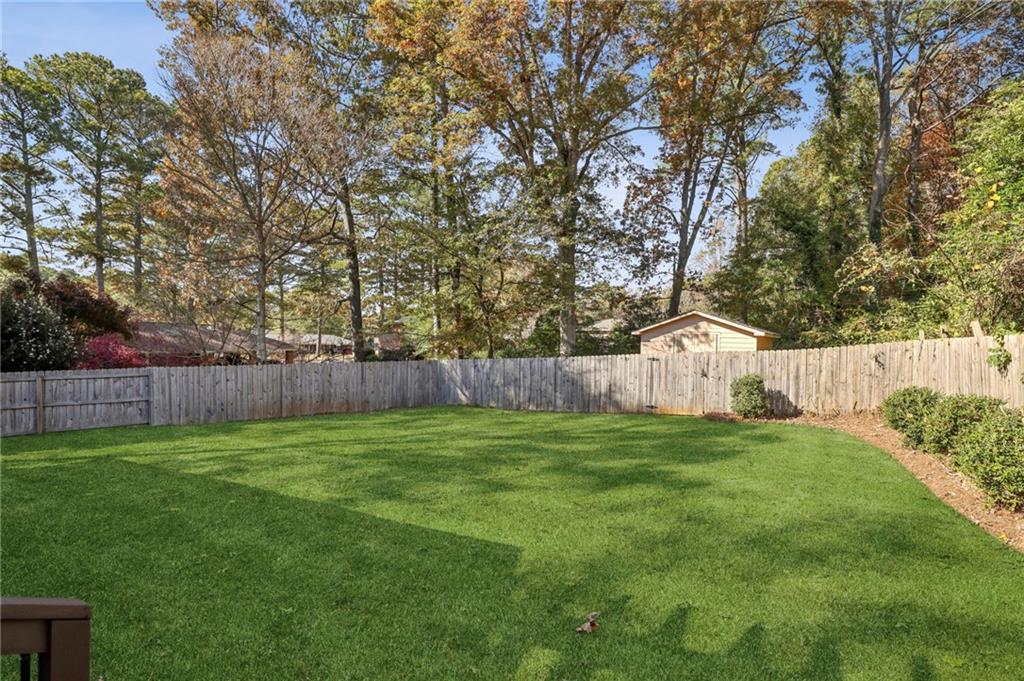 3170 Lavista Road Decatur, GA 30033 - Photo 26 of 29 a view of a yard with a tree and wooden fence