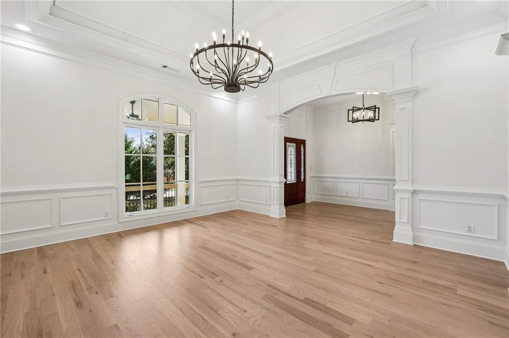 3170 Lavista Road Decatur, GA 30033 - Photo 7 of 29 a view of an empty room with wooden floor and a window