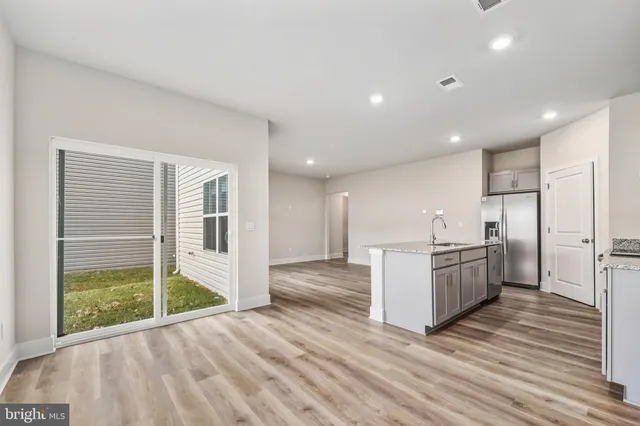 a view of a kitchen with a sink and an oven