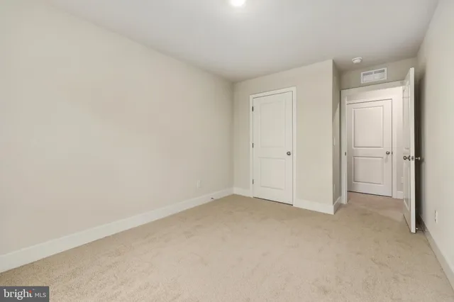 a bathroom with a granite countertop toilet a sink and a bathtub