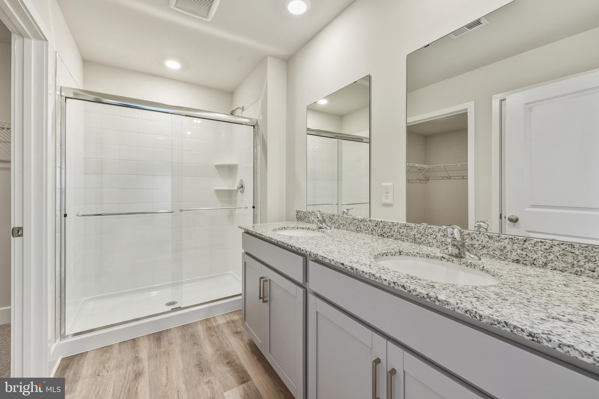 226 Munsee Winchester, VA 22603 - Photo 22 of 33 a bathroom with a granite countertop sink mirror and shower