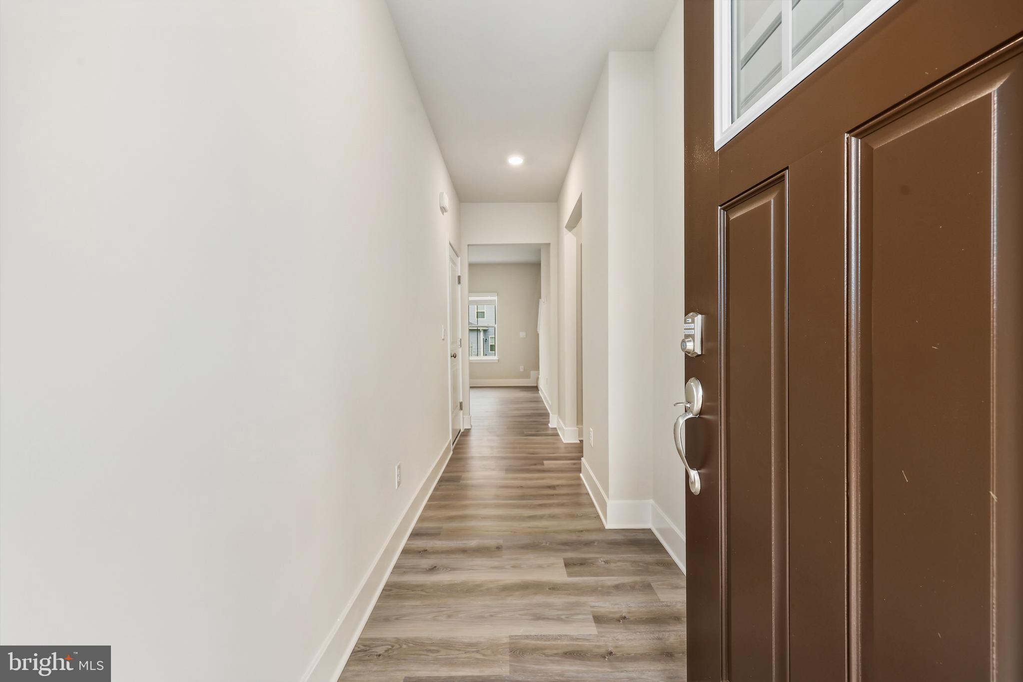 226 Munsee Winchester, VA 22603 - Photo 3 of 33 a view of a hallway with wooden floor and staircase