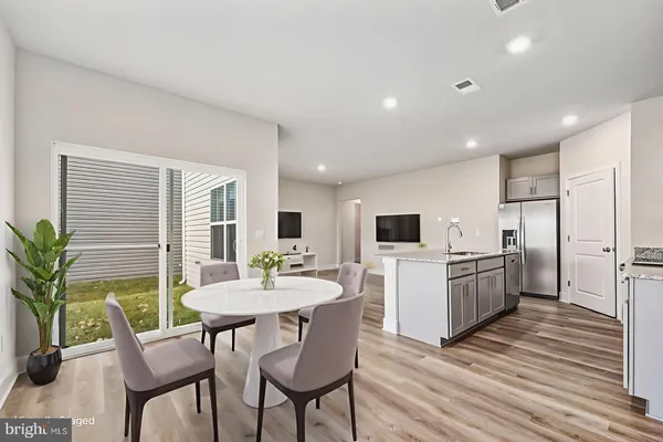 a kitchen with a table and chairs in it