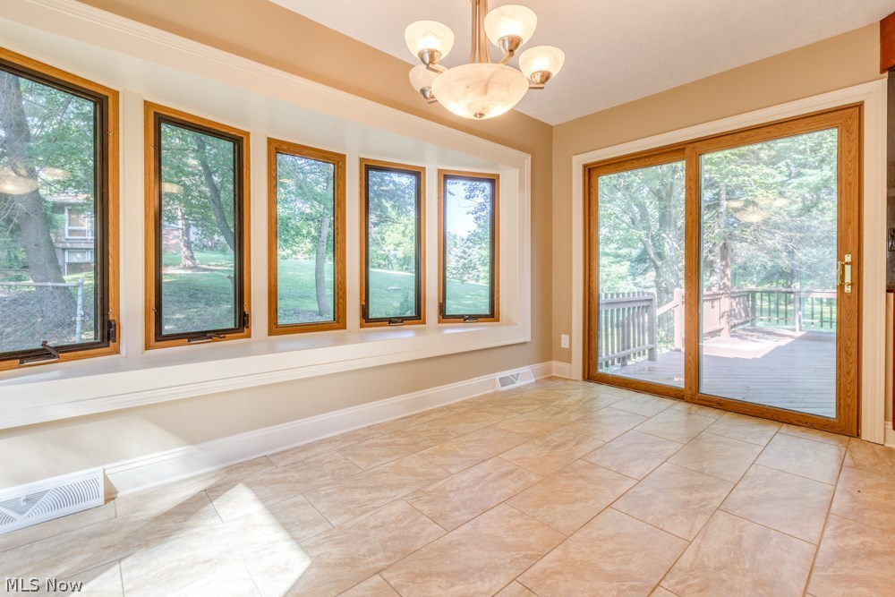 7925 Dines Road Novelty, OH 44072 - Photo 9 of 25 DINING ROOM WALKOUT TO REAR DECK