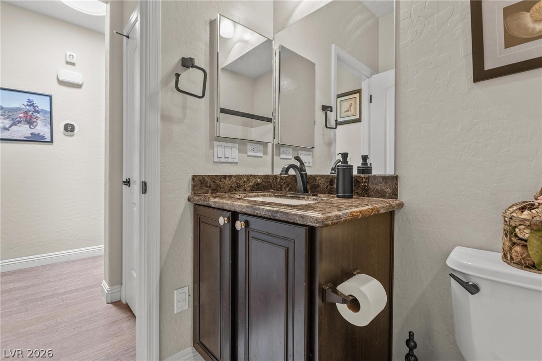 8431 Durango Ranch Court Las Vegas, NV 89113 - Photo 23 of 49 This bathroom features a contemporary vanity with a sleek countertop.