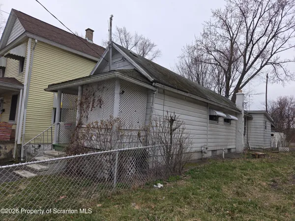 a view of a house with a fence