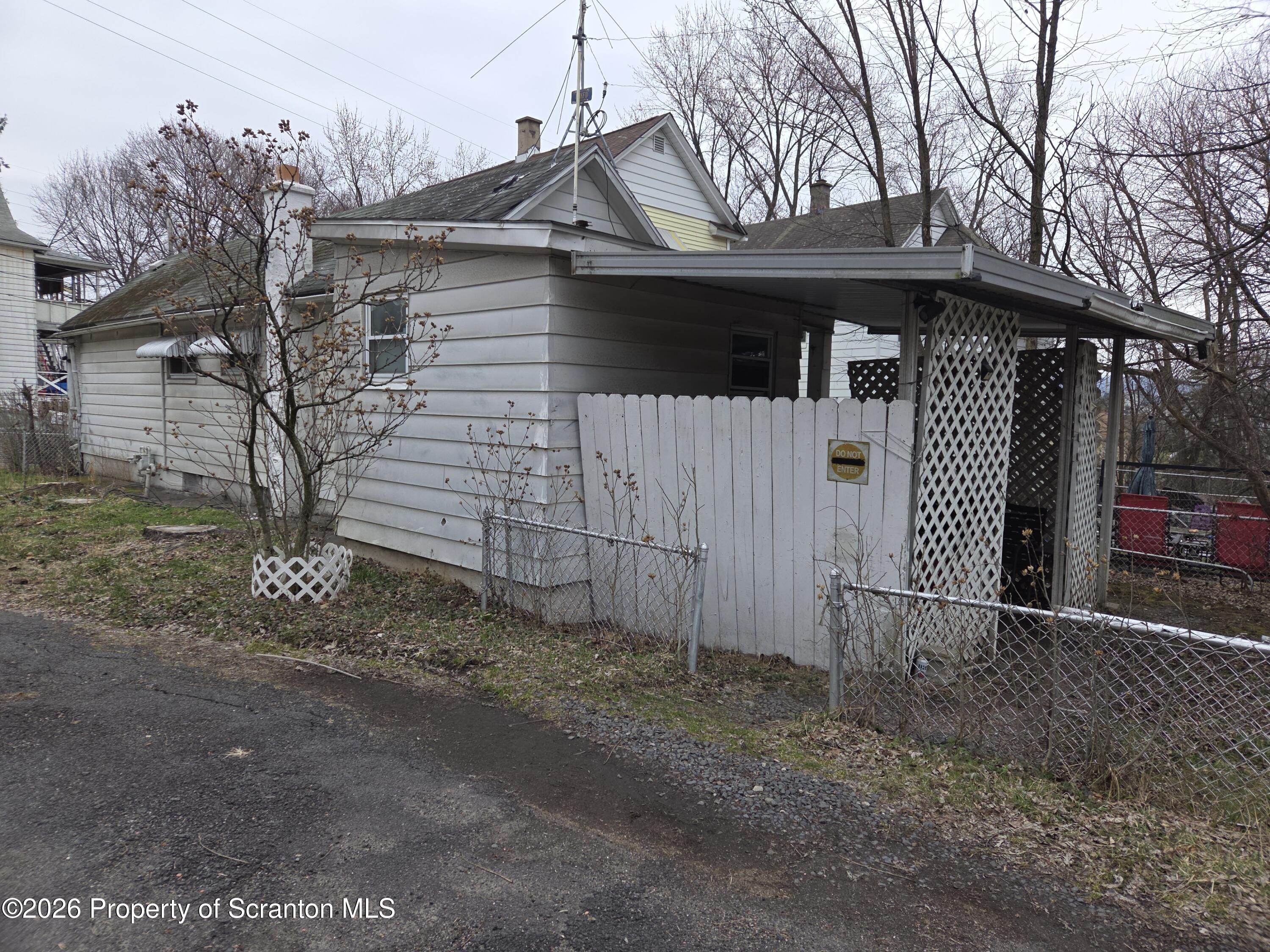 521 Albion Street Scranton, PA 18508 - Photo 3 of 22 a front view of a house with a yard