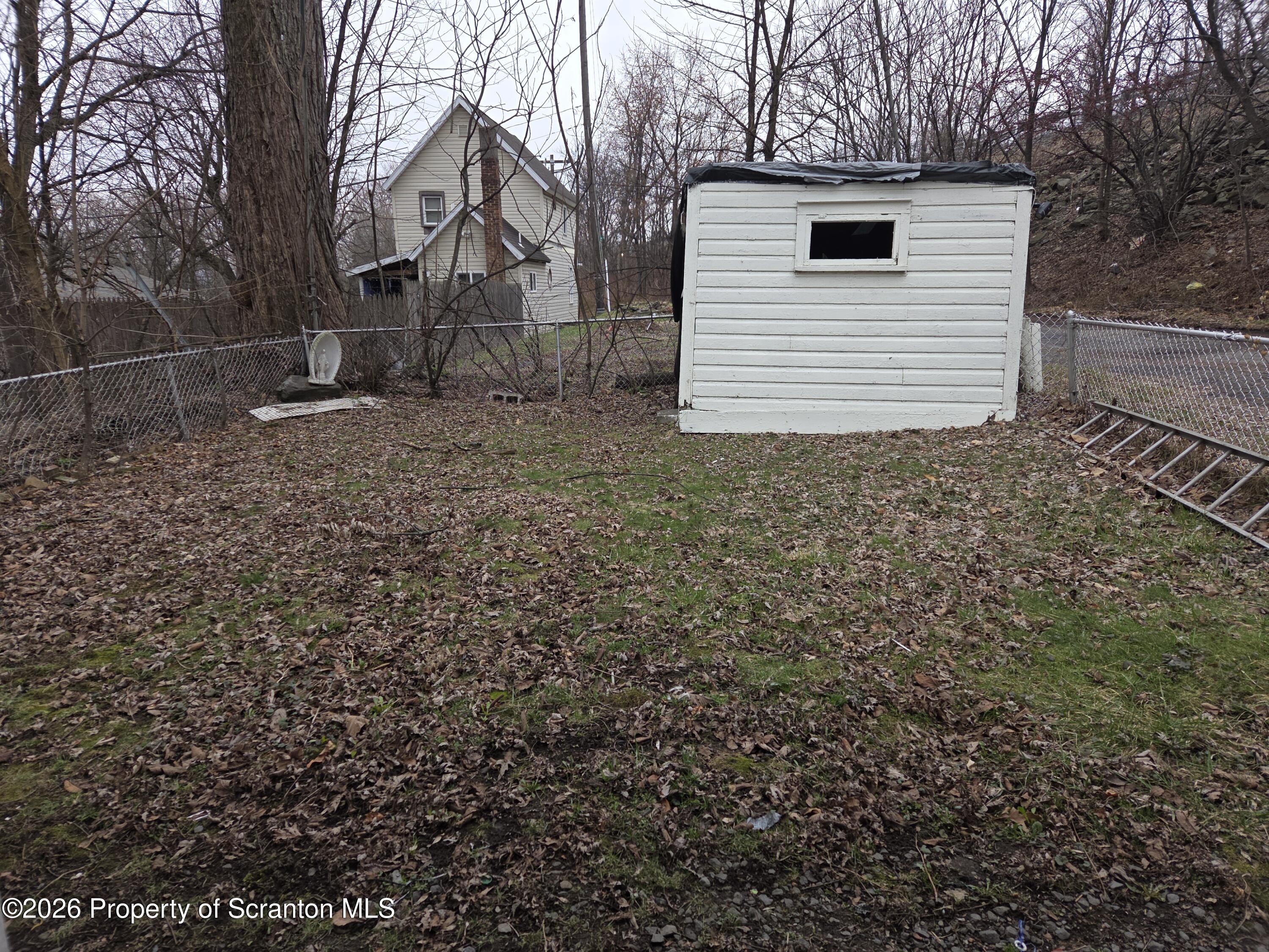 521 Albion Street Scranton, PA 18508 - Photo 6 of 22 a white house that has a tree in front of it