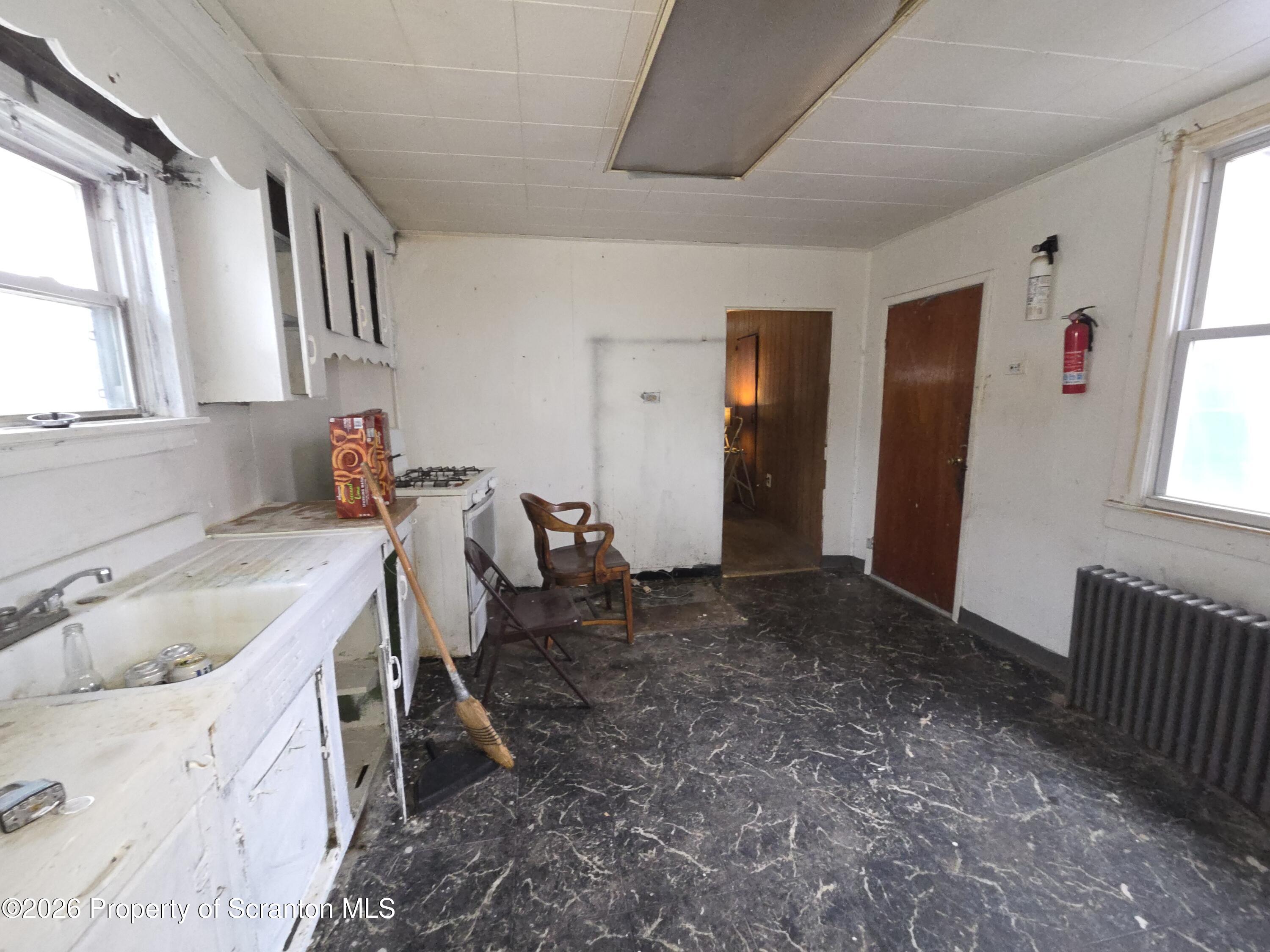 521 Albion Street Scranton, PA 18508 - Photo 9 of 22 a spacious bathroom with a tub sink and mirror
